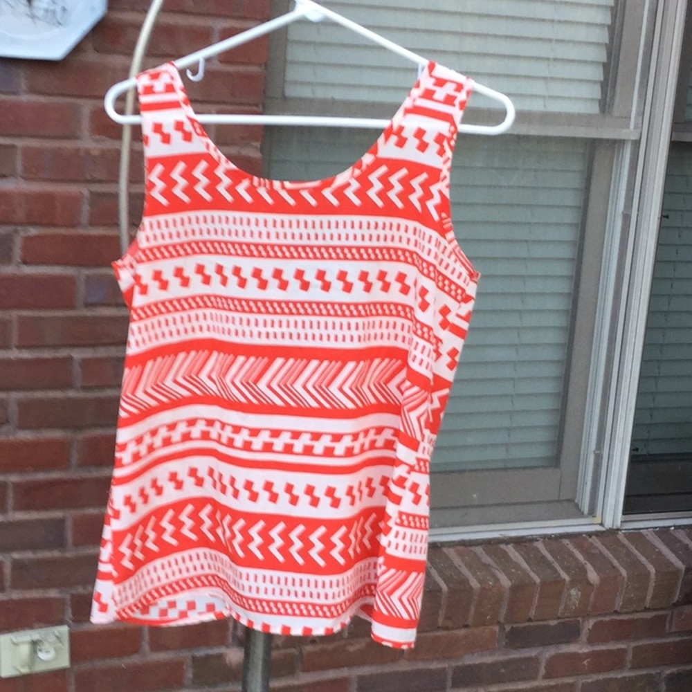 Cream and orange colored top